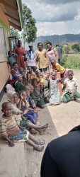 The Rotarians in a group photo with the staff and pupils of Muhanga School