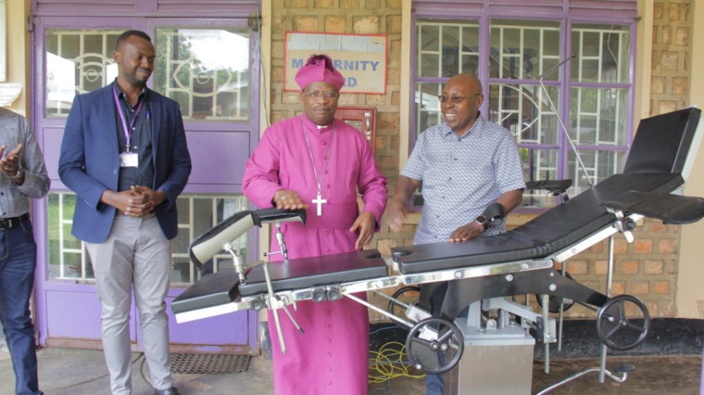 Byengoma ( L) handsover to Bishop Akanjuna (1)