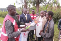 MP Julius Tusiime handing over some Relief items