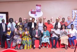 Group photo of the team holding the Hibiscus tea Bags with Regina Nakayenga MD - Copy