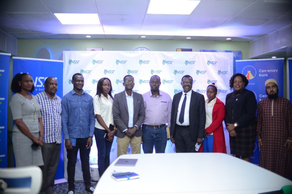 NSSF MD Patrick Ayota ina group picture with the partners on Wednesday