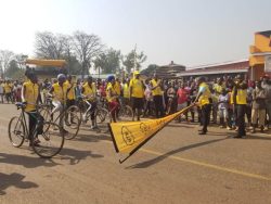 Flagging off cyclists at Anaka Town Council in Nwoya District on Sunday