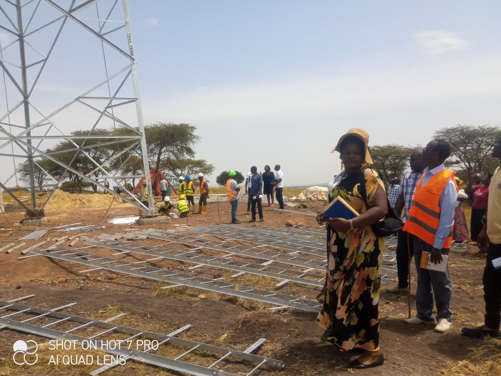 Hon.Loyda and team at the site where mast is being built