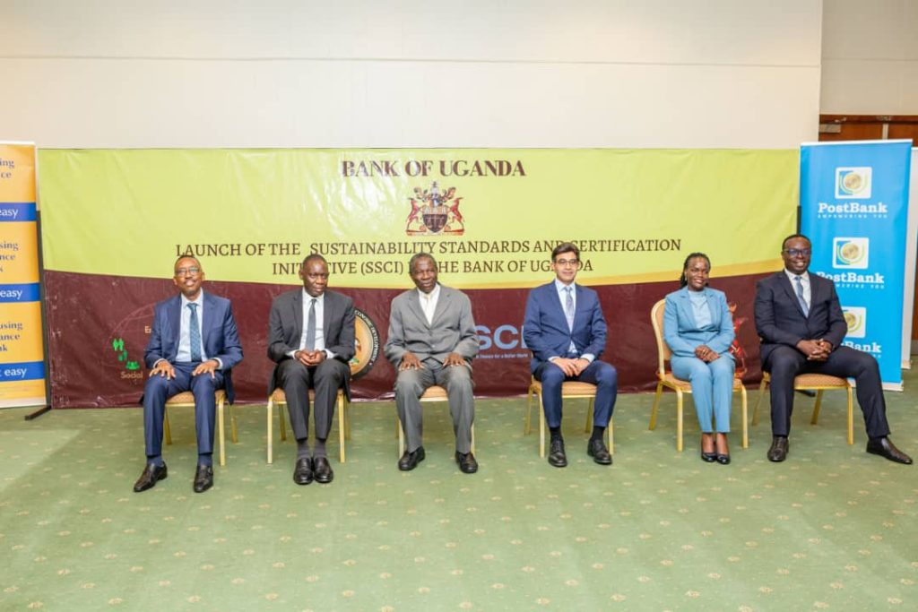 Finance Minister Matia Kasaija (M) flanked by BoU deputy Governor Michael Atingi-Ego (1st left), Arshad Rab (1st right), other stakeholders in a group photo