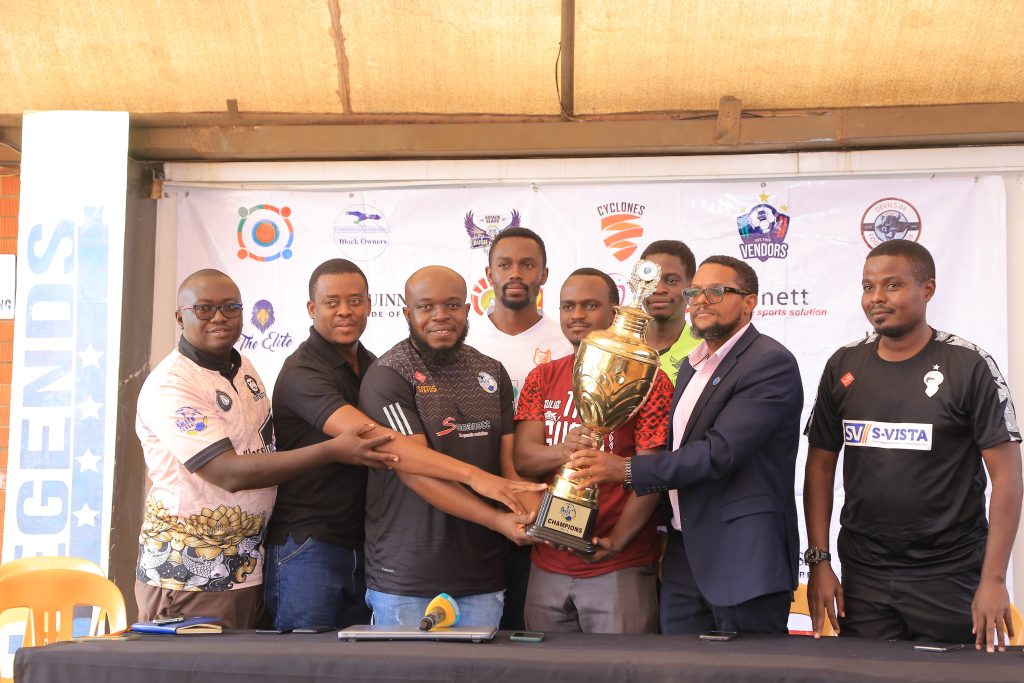 SMACK League organizers and a section of team representatives pose with a trophy that will be competed for in the new season.