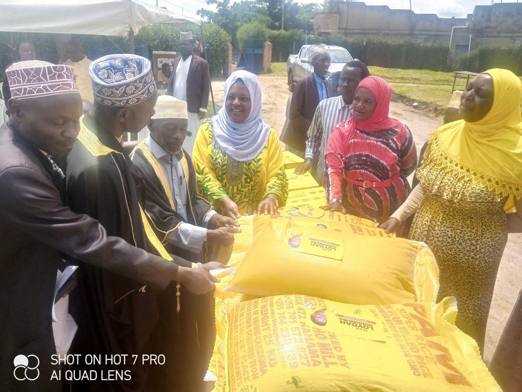 Loyda handing over Food items to Muslim leaders