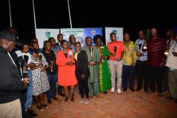 USGA Chairperson Charles Katarikawe (without a trophy) poses for a photo moment with silverware winners on Saturday night