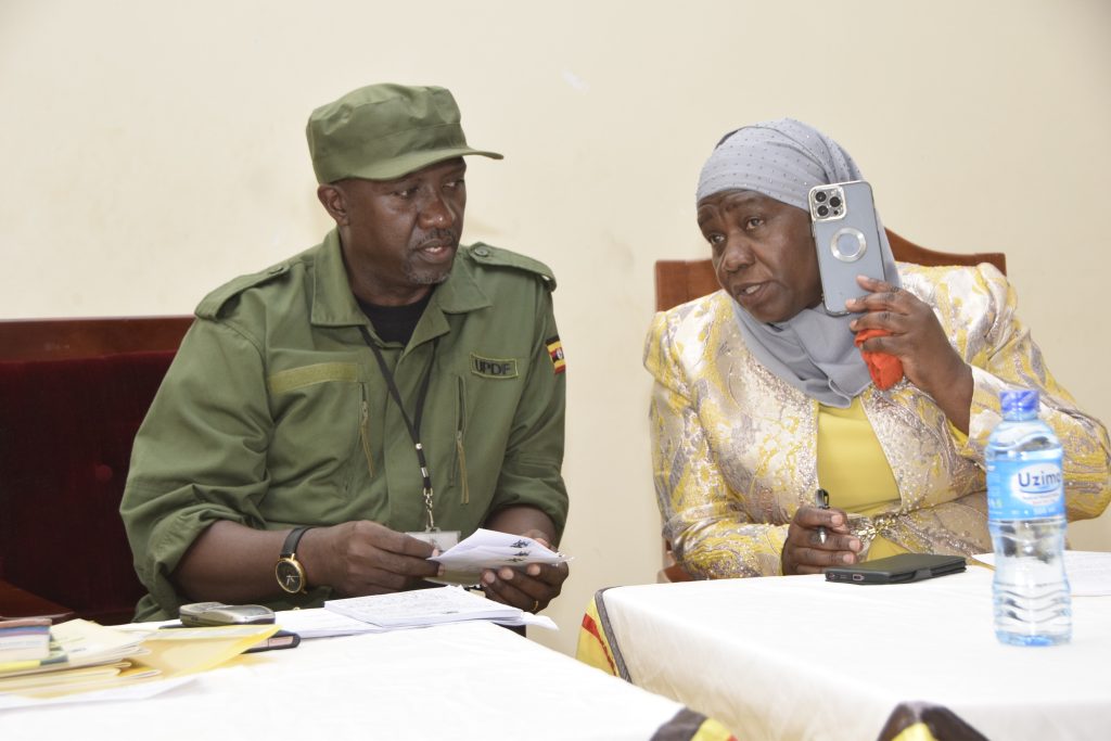 1. MIU Director Willis Bashaasha (L) with Kampala Minister Minsa Kabanda who represented Presidency Minister Babalanda (1)