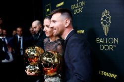 Lionel Messi and Aitana Bonmati pose for a photo after winning the Men and Women Ballon d'Or 2023