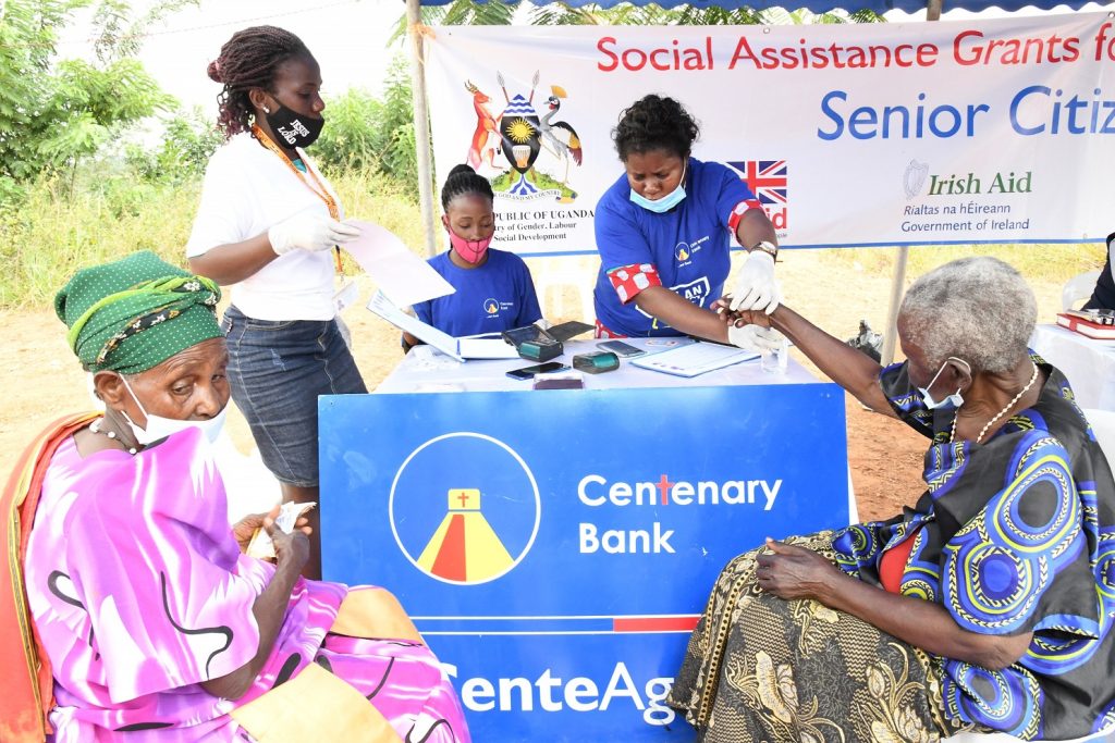 Older persons getting paid in Bukomansimbi through Stanbic bank