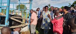 Kakwenzire, the head of Poverty Alleviation Statehouse handing over