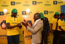 L-R Alex Wekoye, Chief Commercial Officer MTN MoMo and the Arua Deputy RCC. Hamza Ezama Muzamiru celebrating the new milestone
