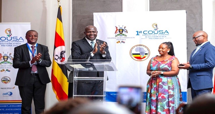 Uganda's High Commissioner to South Africa, H.E. Paul Amoru (second, left) introducing Andile Ramaphosa (R) and his wife, Bridget