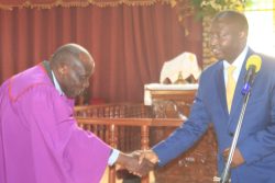 head of laity Diocese of Kigezi Canon Munono with Minister bahati at thr fucntion