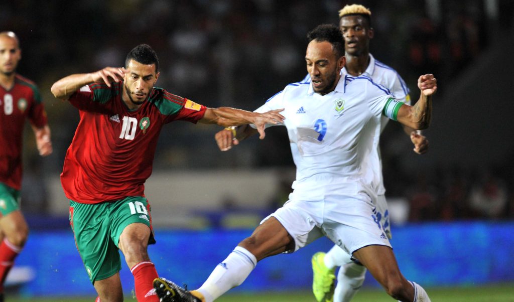 pierre-emerick-aubameyang-right-of-gabon-is-challenged-by-younes-belhanda-of-morocco-during-the-2018-world-cup-qualifying-game-between-morocco-and-gabon