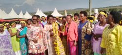 Guest of Honor Kaboyo, Woman Kamateneti, Area MP Kabasharira, and other MPs receiving a gift from the Women