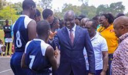 St Marys Kitende Director Dr Mulindwa during USSSA-Elite games greeting Basketball players