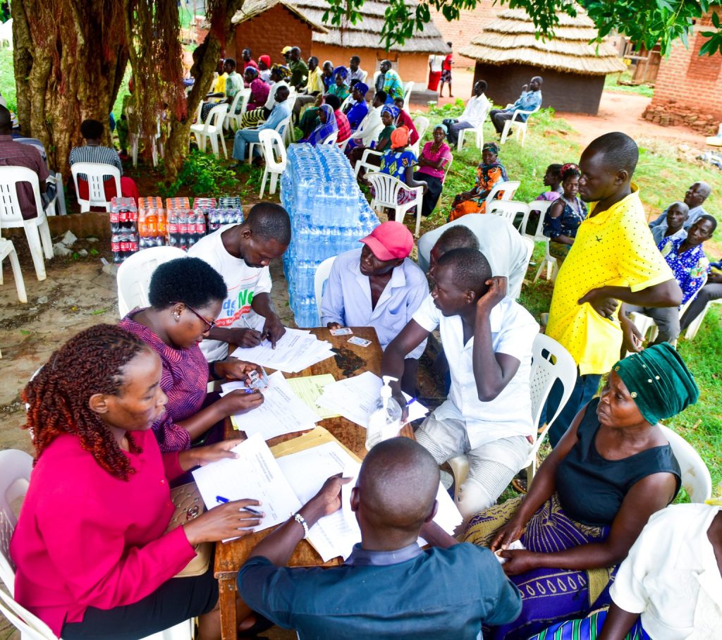 Beneficiaries-of-Pokwero-sub-county-confirming-their-names-1-1-1536x1362