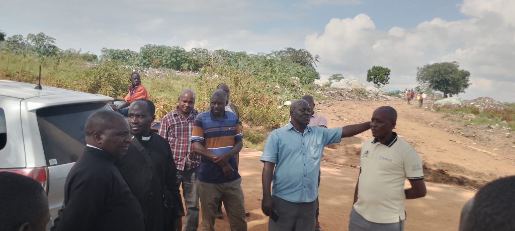 Priests, Leaders and Locals at Kenkombe garbage dumping site in a demonstration mood