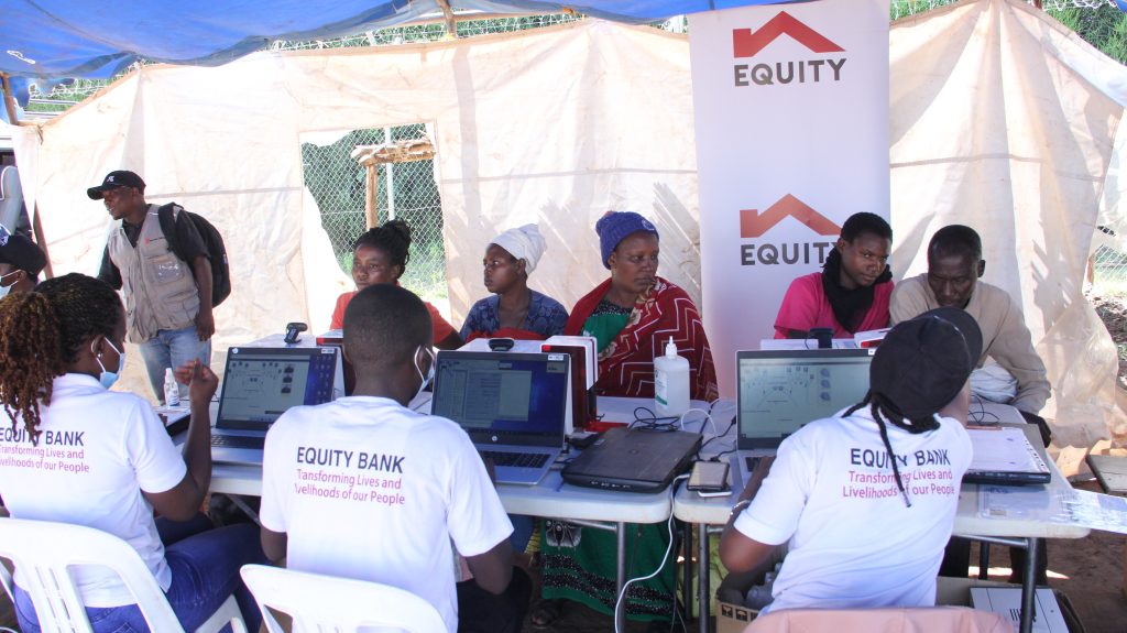 Additional photos of refugees being served by Equity Bank Uganda Limited officials