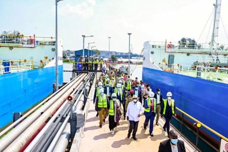 President Museveni is led on a guided tour of the two oil vessels after commissioning Lake Victoria Logistics at Kawuku on Thursday. He was led on the tour by Hon Nankabirwa, Mukula and Ravi. PPU Photo