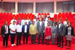 UIA Director General Robert Mukiza (4R) and Daudi Migereko (4L) with Kikuubo traders at UIA Head Office in Kampala