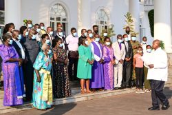 President Museveni R interacts with family members of the Late Col Okello Engola and boxer Zebra Ssenyange after a reconciliatory meeting at State house Entebbe