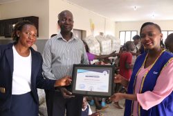 Carrefour leadership team recieves a Certificate of Appreciation from Kireka Home for the Mentally Handicapped