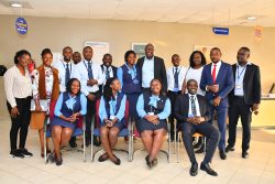Francis Karuhanga (C), the Stanbic Holdings Uganda Limited (SUHL) Chief Executive pose for a group photo with Ishaka Branch branch staff ahead of the Ankole region SACCO Forum.