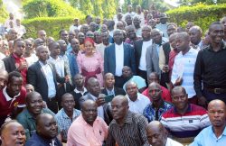 Iganga woman MP Sauda A. Kauma (in gomesi) and Farouk Kirunda (to her left) pose for a photo with Busoga Masters of Ceremonies (MCs) at Skyeez Hotel on Wednesday in Iganga town. (PHOTO BY GEORGE BITA)