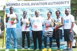UCAA'S Fred Bamwesigye in a group photo with the winners