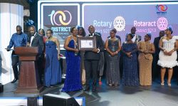 Centenary Bank Managing Director, Fabian Kasi receiving the platinum sponsor’s award on behalf of Centenary Bank at the Rotary District Conference held in Jinja.