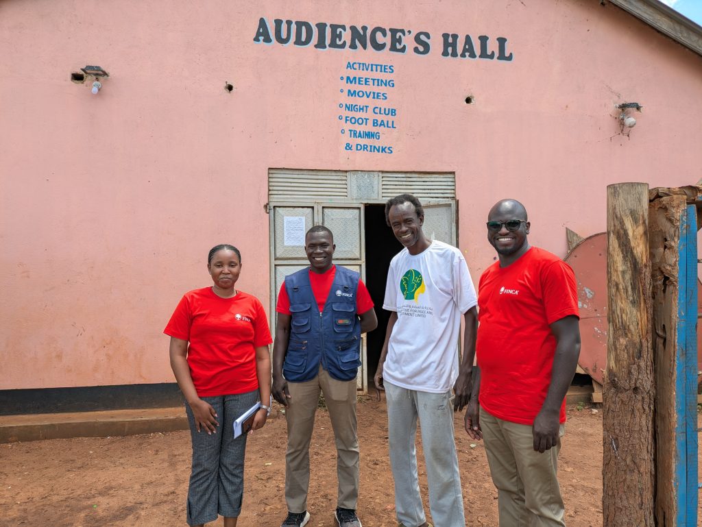 Finca Officials together with Refugees pose for a group photo