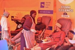 John Baptist Kaweesi-Head Mortgage and Consumer Banking at HFB and Mufaddal Yeolawala - MD Universal M. Enterprises donating blood during the drive