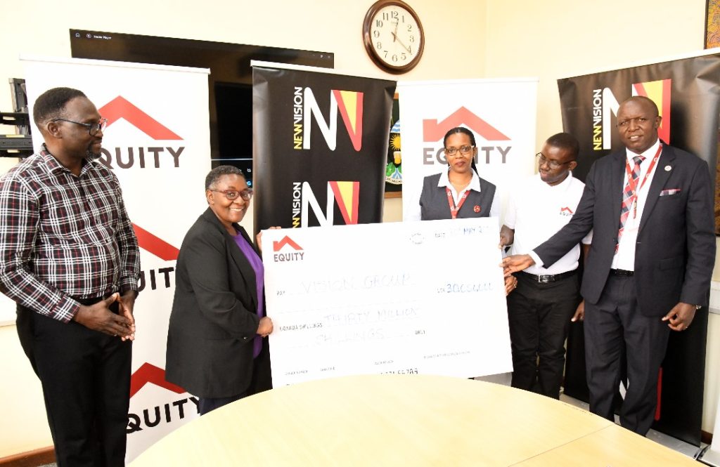 Equity Bank Uganda Officials Handing Over a Donation of Shs 30 million towards the 2025 Martyrs Choral Festival