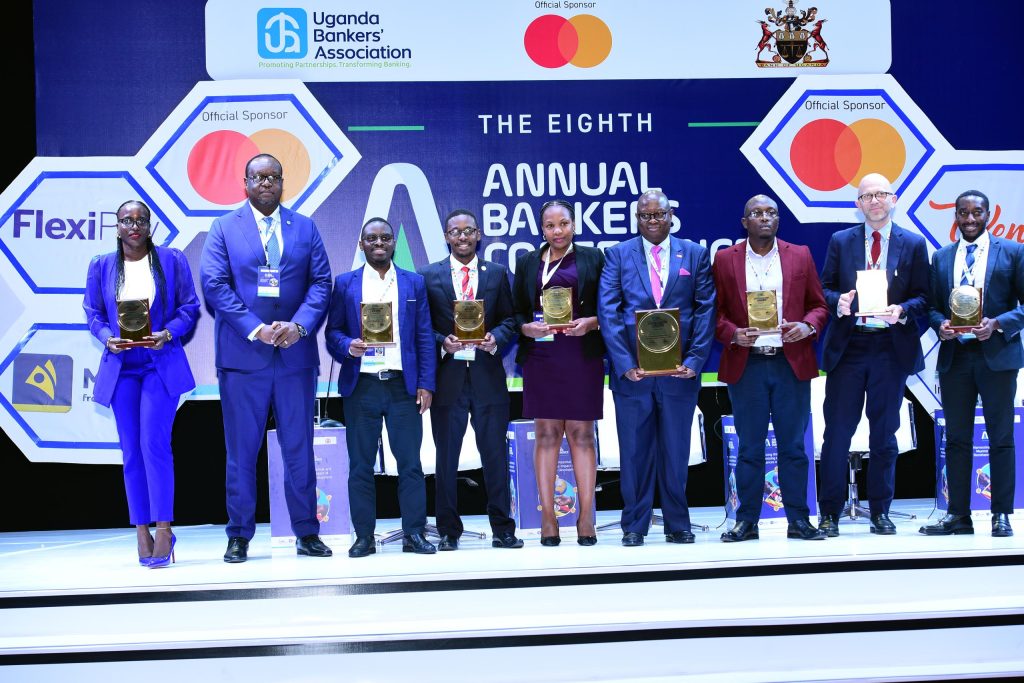 A photo moment of Stanbic's Mumba after awarding sponsors for the Annual Banker's Conference