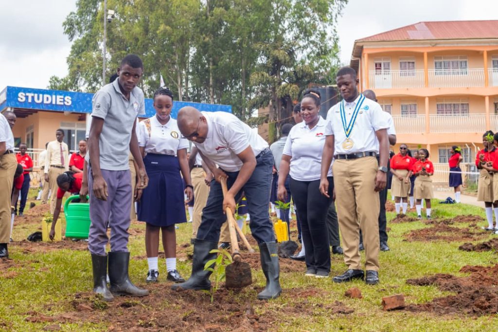 Equity Banks MD Gift Shoko during the tree planting activity.