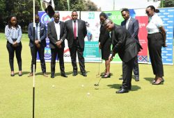 Kenya’s High Commissioner to Uganda, Ambassador Joash Maangi, tees off with other partners looking on at the Kampala Golf Club