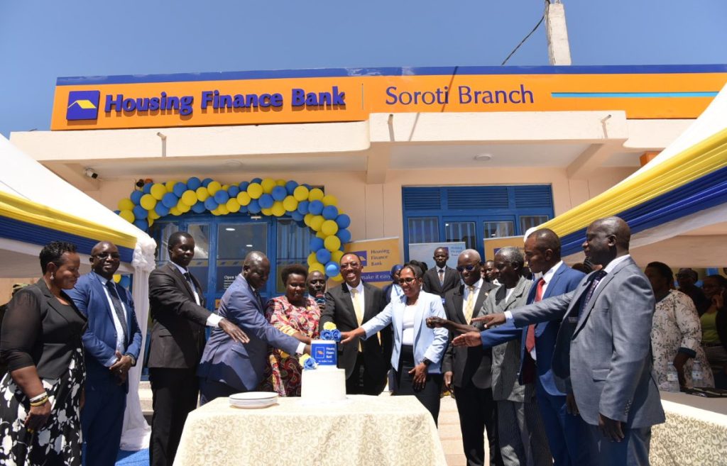 Vice President Jessica Alupo, and Michael Mugabi MD Housing Finance Bank(Center) joins other HFB officials to cut the cake during the opening of Soroti Branch