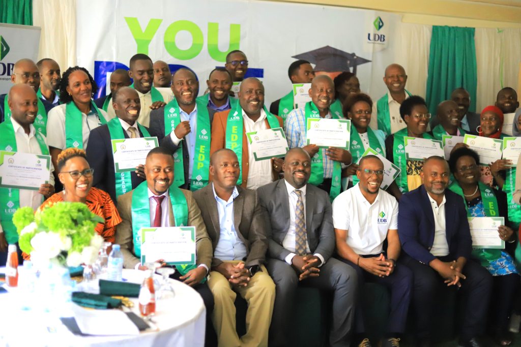 Graduates of the EDP Mbarara cohort pose for a group photo during the graduation ceremony