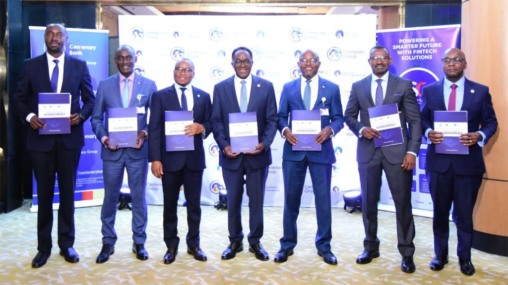 Officials from Centenary Group and Service Cops after the signing of the Memorandum Of Understanding to accelerate digital financial inclusion