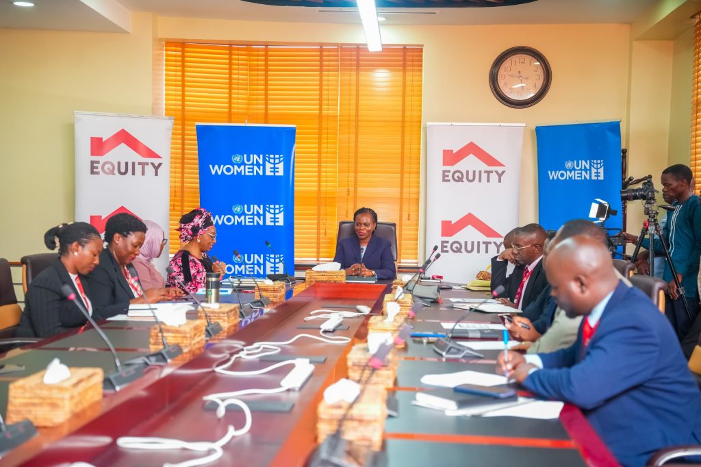 Photo 04 - Officials from UN Women and Equity Bank Uganda in a group photo after the launch of the partnership this morning at the bank's head office, Church House kampala