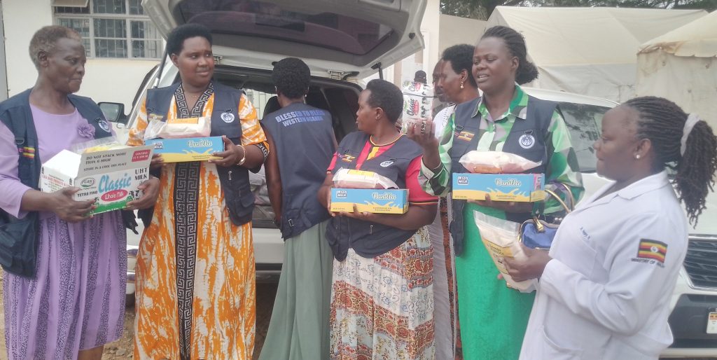 A team from CHESED intruducing some of the items to the Doctor at Mbarara HC4 for distribution to the needy