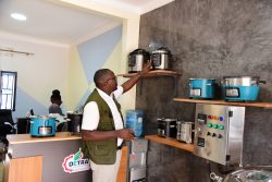 David Ucha showcasing some of the eco stoves that Detra Energy and Environmental Contractors offers
