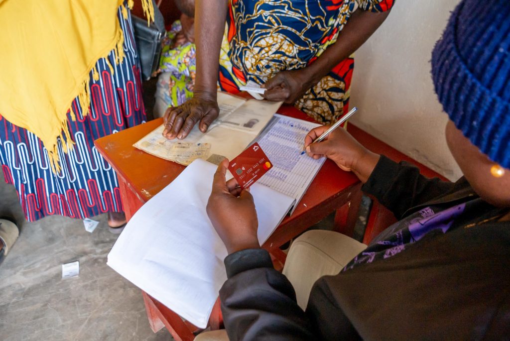 Equity Bank staff working on one of the Refugee client