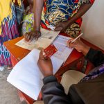 Equity Bank staff working on one of the Refugee client