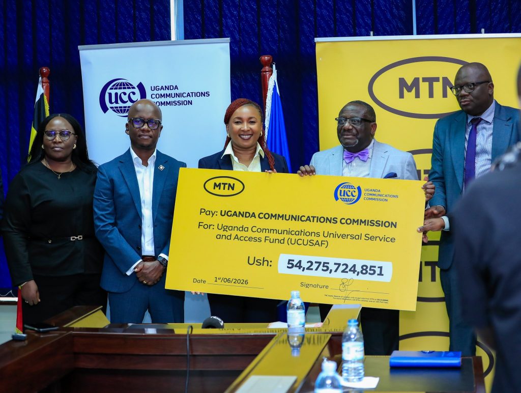 Part of MTN's leadership team poses for a photo with UCC's Leaders shortly after the cheque handover