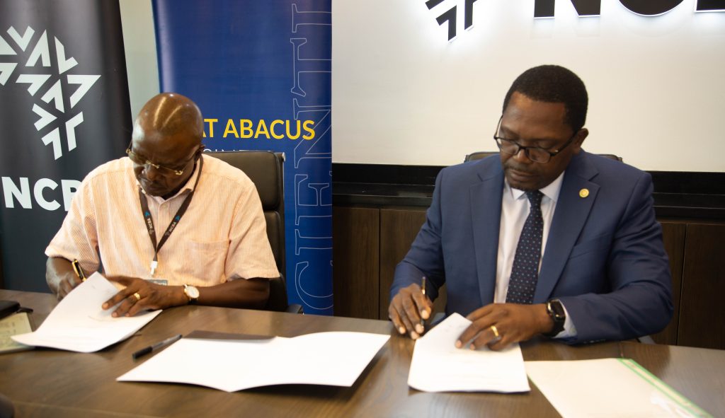 Prof. Samuel Sejjaaka and Mark Muyobo signing a strategic partnership agreement between NCBA Bank Uganda and MAT Abacus Business School. Courtesy of NCBA Bank Uganda.