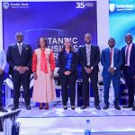 Tunde Thorpe (2 L) , Executive Head of Business and Commercial Banking pose for a group photo with panelists during the Regional Forum in Kampala.JPG
