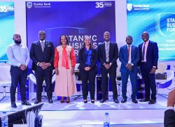 Tunde Thorpe (2 L) , Executive Head of Business and Commercial Banking pose for a group photo with panelists during the Regional Forum in Kampala.JPG